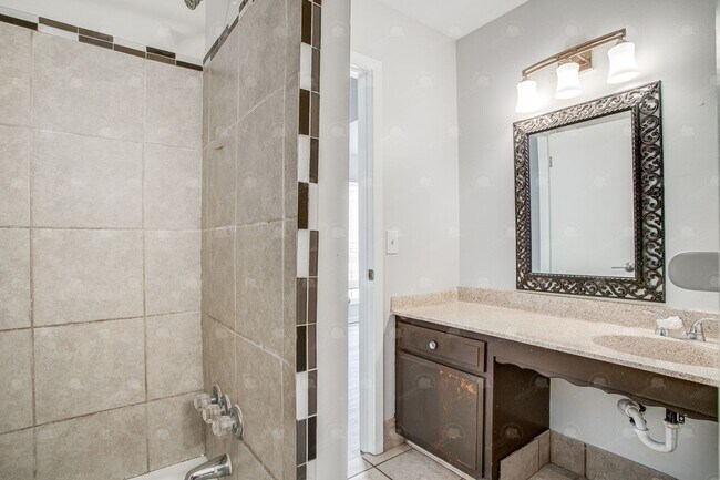 Building Photo - **Spacious 3-Bedroom Townhome with Partially Finished Basement and Off-Street Parking**