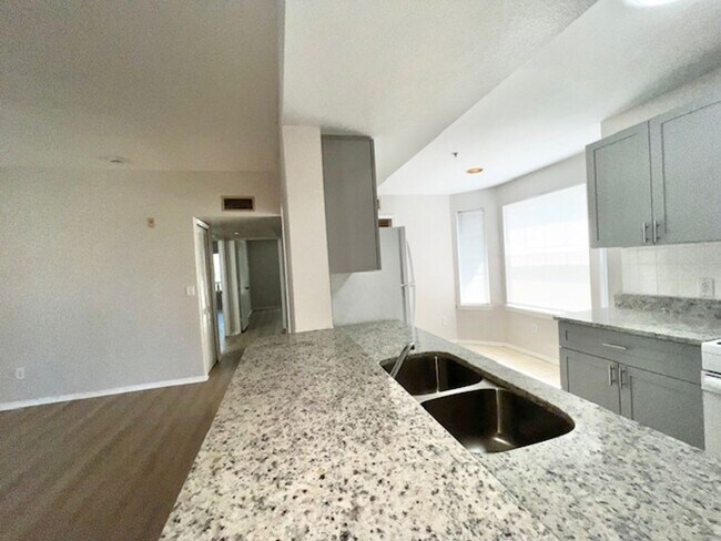 Building Photo - NEW-Remodeled bathroom & kitchen! NEW VINYL PLANK flooring & fresh paint! 2 bedroom 1 bath condo ...