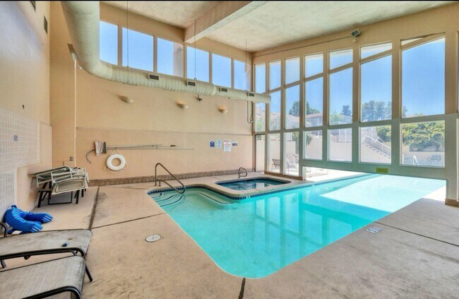Building Photo - Recently updated condo with gym, pool, and...