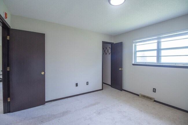 Building Photo - Charming 3BR Home-Screened Porch, Private Garage & Massive Backyard