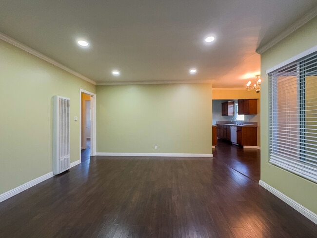 Ample Living room with new recessed lighting. - 12063 Lamanda St