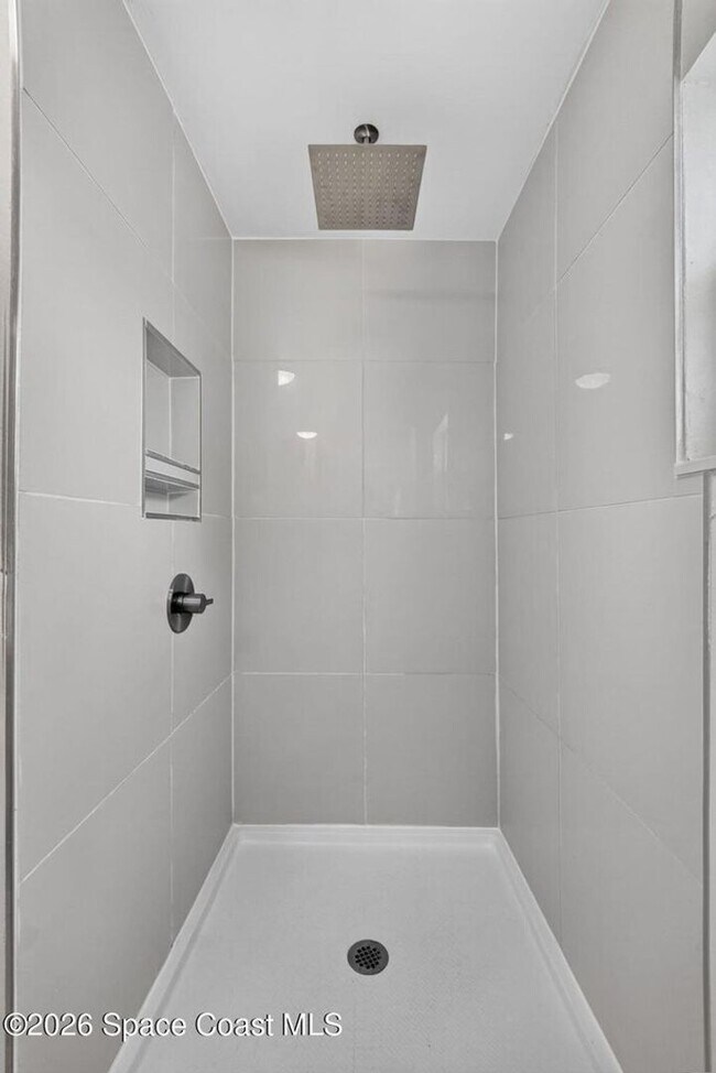 Building Photo - Welcome to this beautifully remodeled 4-bedroom, 3-bath home in the heart of Indialantic Beach!