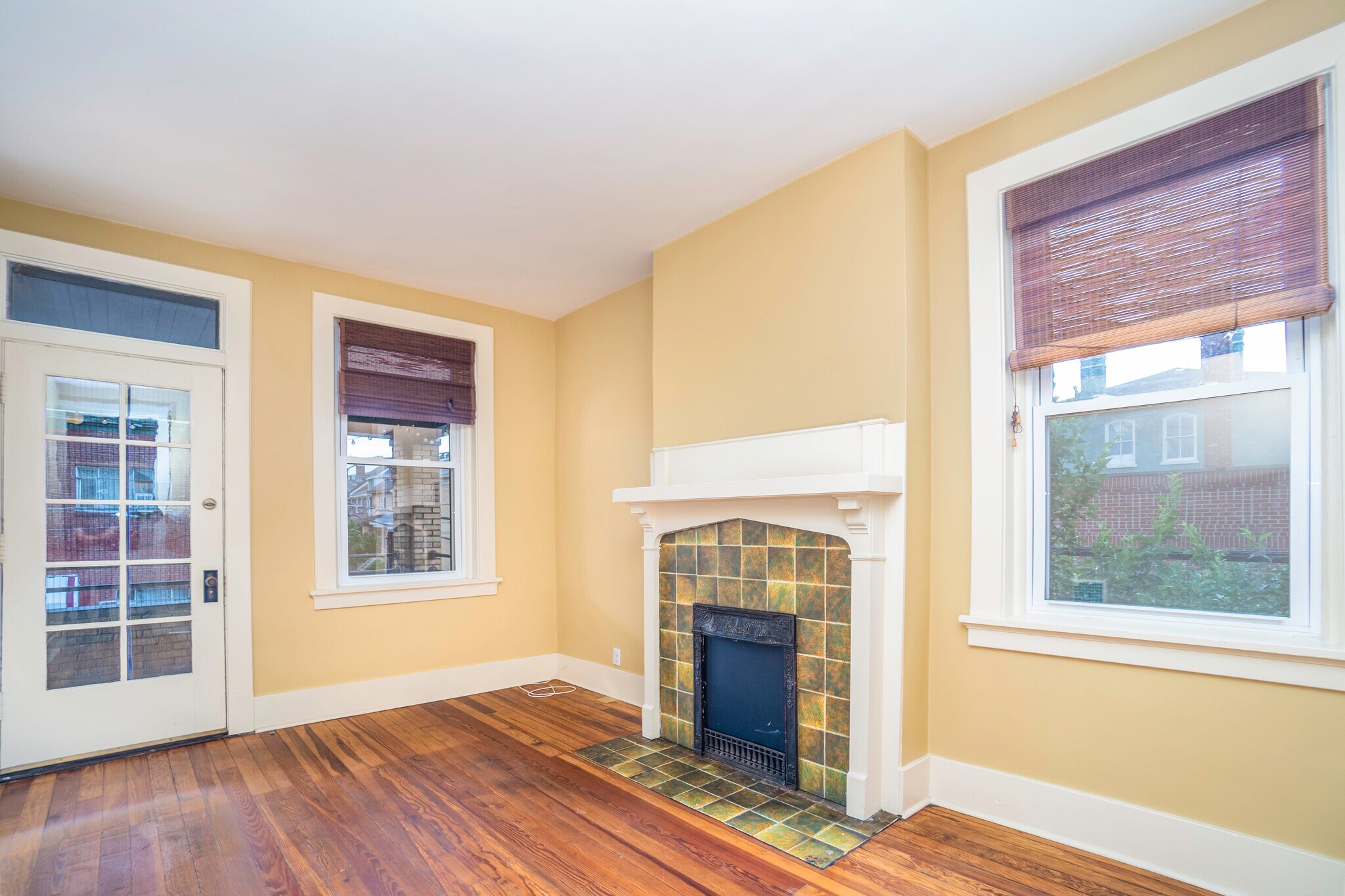 Living room that has a door to the front balcony - 4121 Davison St