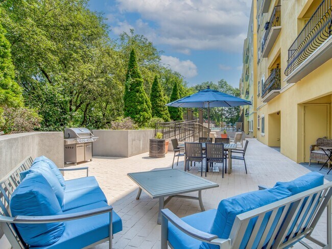 Outdoor patio with grills and plentiful seating - Windsor at Midtown