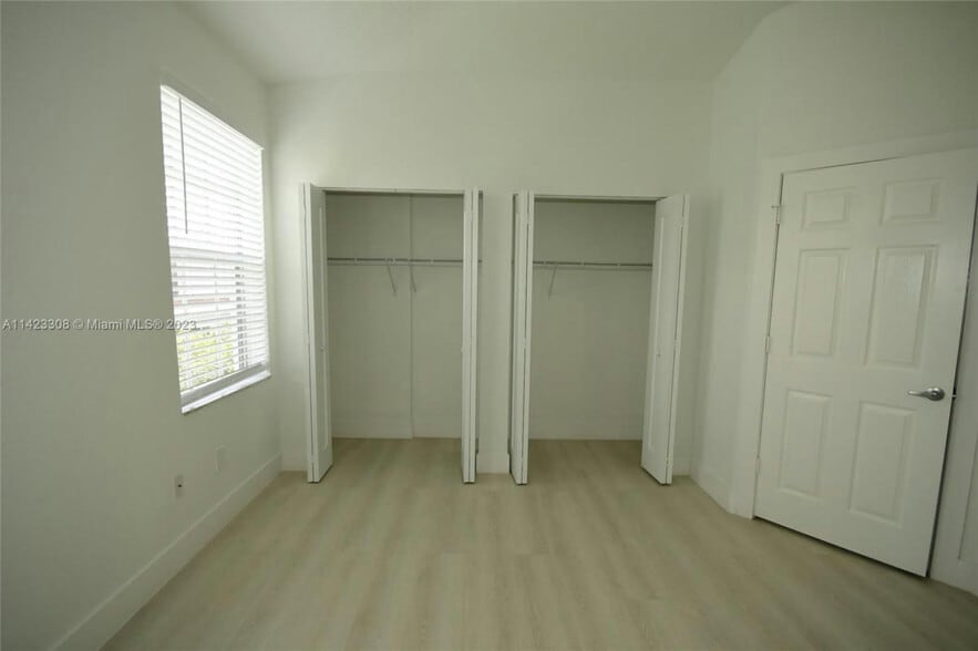Double his and her closet vaulted ceilings - 705 SW 148th Ave