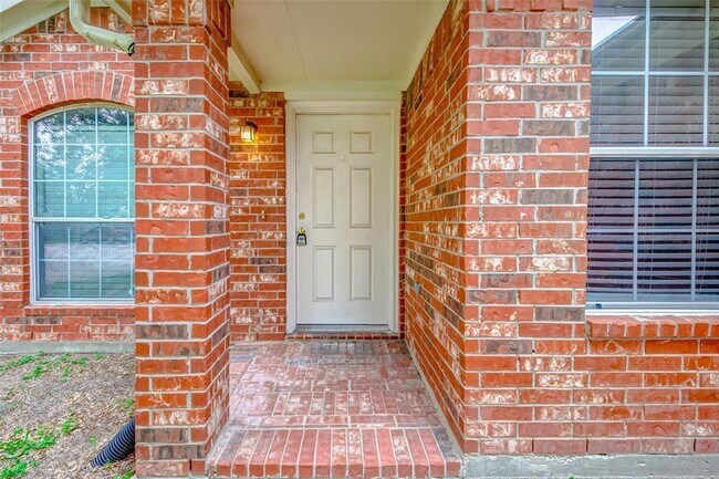 Building Photo - This one-story, three-bedroom, two bath ho...