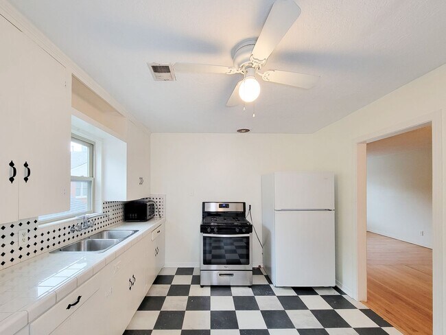 Building Photo - Step into your new home nestled in the vib...
