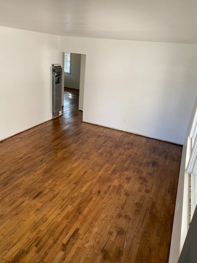 Living room- refinished floors 10/2/23 - 14421 Kingsdale Ave