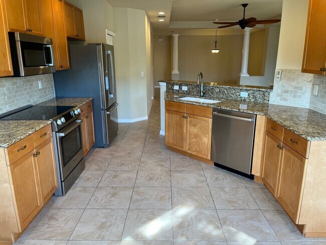 Building Photo - Meadows of Estero 1st floor unit with 2 car garage