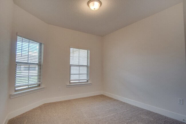 Building Photo - Spacious Cantonment Townhome with Open Layout, 2-Car Garage, Covered Back Porch & Easy Access to ...