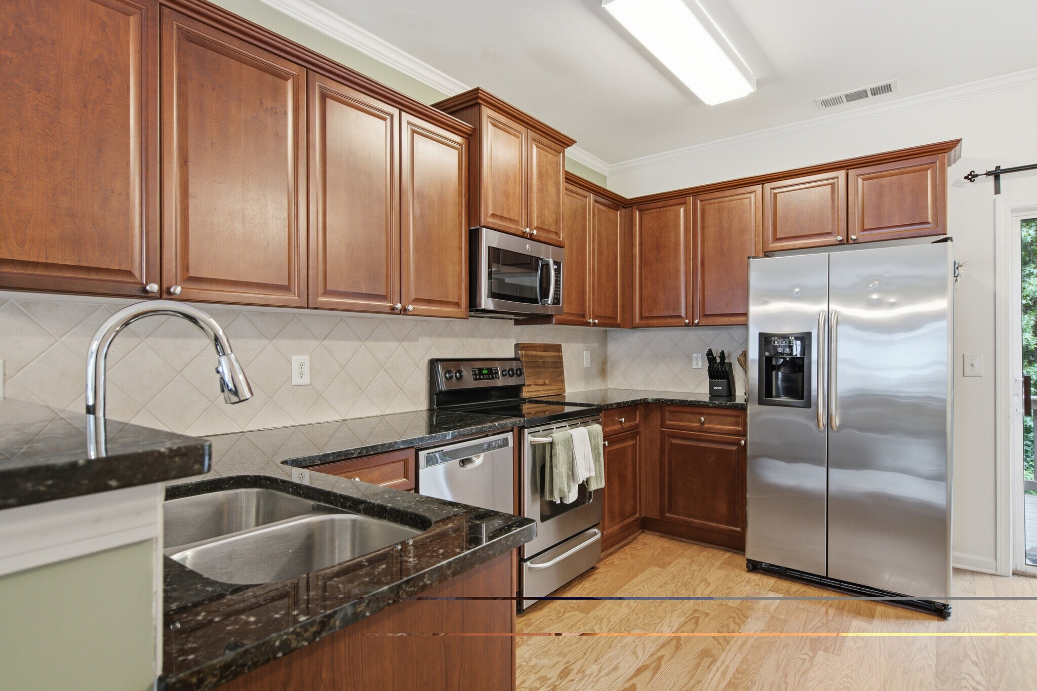 Kitchen with stainless steel appliances - 1225 Liberty Pky NW