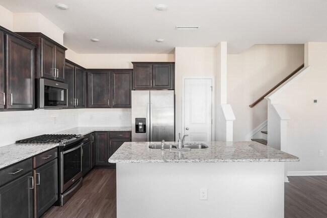 Building Photo - End unit townhome loaded with upgrades close to RTP! Available: Now