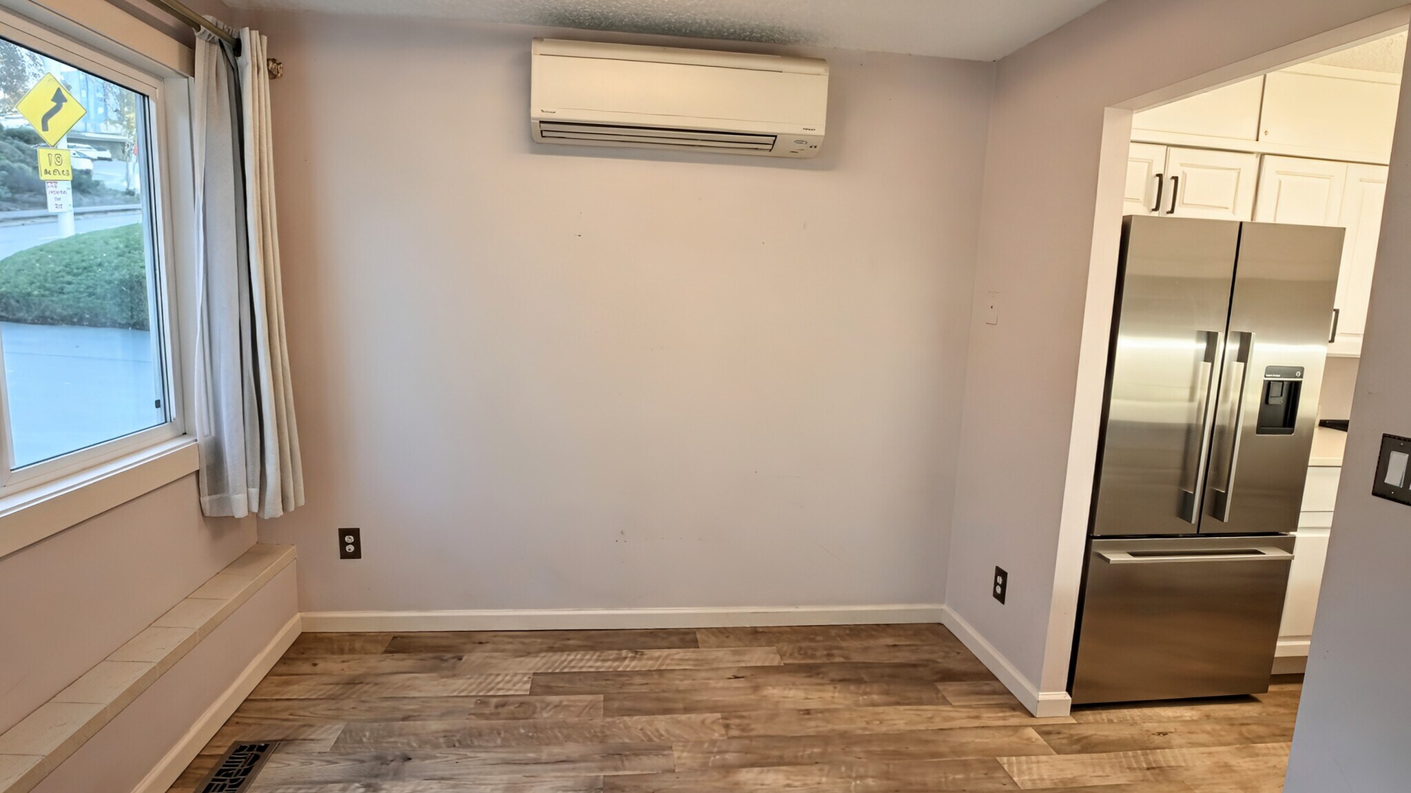 Dining area w/ mini split above - 3711 26th Pl W