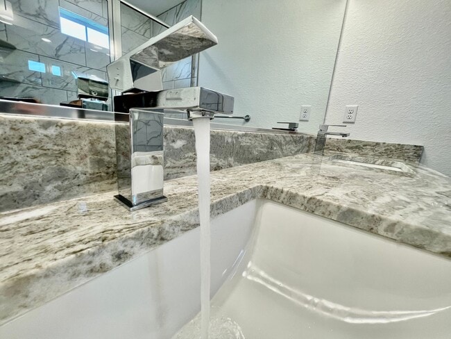 Building Photo - Practically New & Available NOW! Americana Luxury Townhomes! Pet Friendly! Attached Garage! All A...