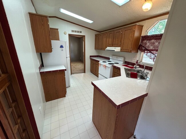 Building Photo - 3 Bed 2 Bath Mobile Home with Fenced Yard and Storage Shed