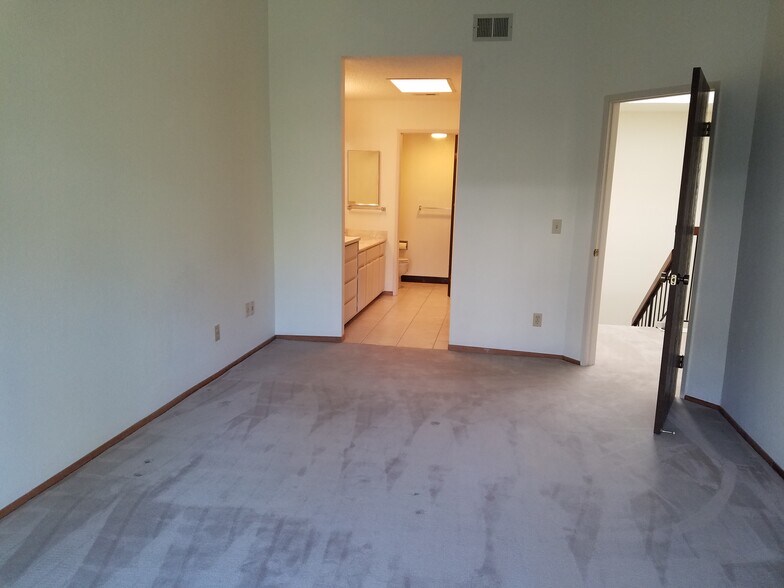 bedroom 1 entry to bath area - 1896 Mountain Creek Ct