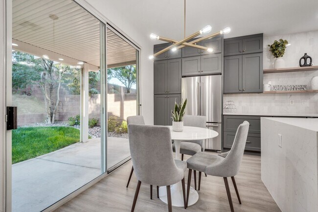 Building Photo - FULLY FURNISHED! Exudes sophistication with designer touches throughout