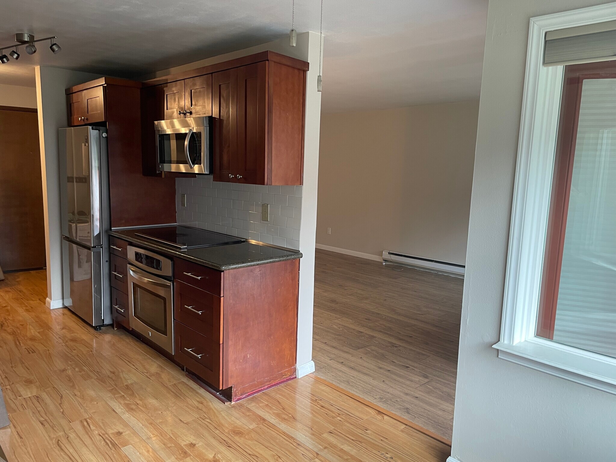 looking at north wall of cabinets in kitchen. (front entry is beyond). - 7001 Sand Point Way NE
