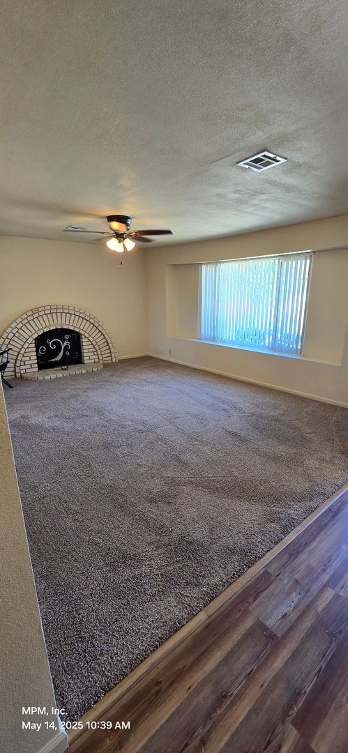 Building Photo - 4 Bedroom 2 bath home with 2 car garage, y...