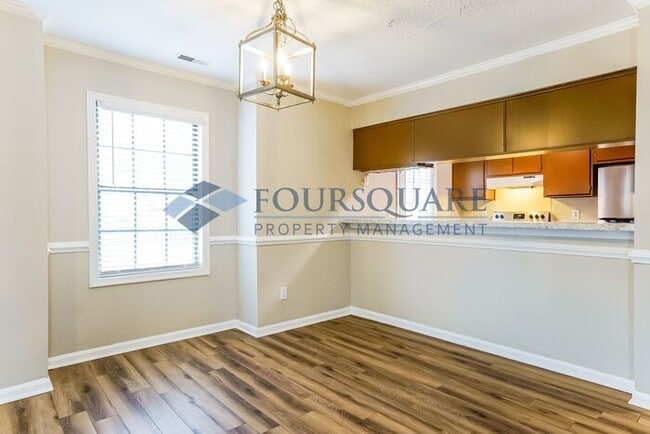 Building Photo - Inviting 2-Bed Townhome with Front Porch, Private Parking  & Storage