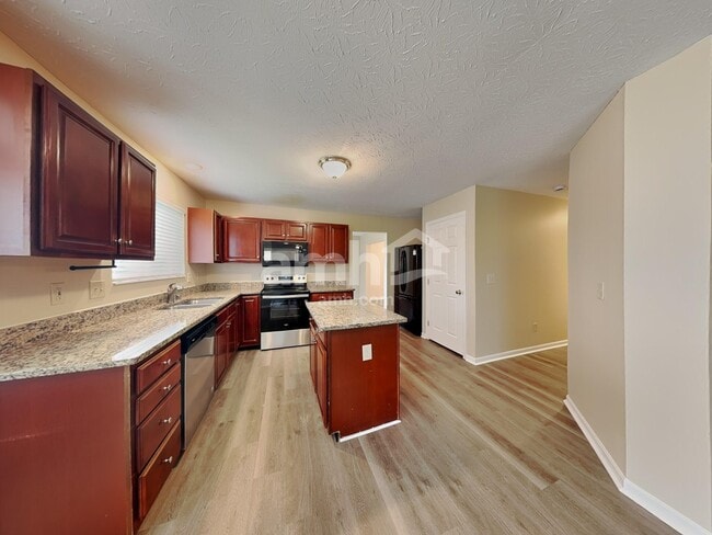 Building Photo - 6297 Satin Wood Dr