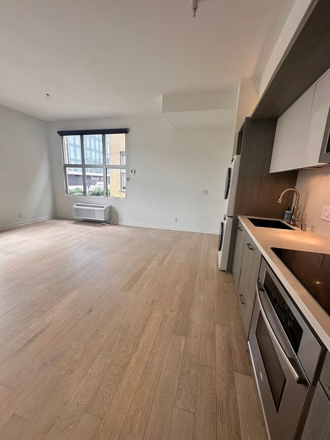 Building Photo - DOWNTOWN GEM | Modern Two-Level Loft with Private Patio & Rooftop Deck