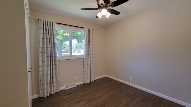 Bedroom 1. Perfect for a bedroom, nursery, bunk beds, office or craft room. 4 ft wide closet. - 6305 49th Ave