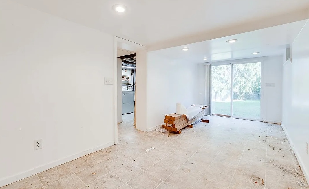 Finished basement with glass sliding doors to the back yard - 133 Hamburg St