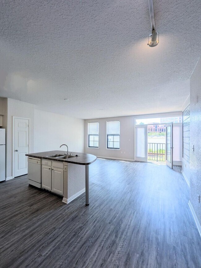 Building Photo - 2x2 Conveniently located. Large open concept, bright and updated: 1075 square feet.