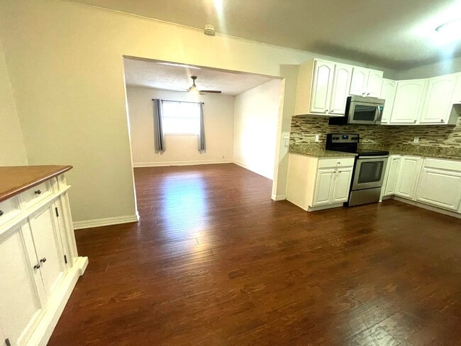 kitchen leading to second living room - 6604 S Mascotte St