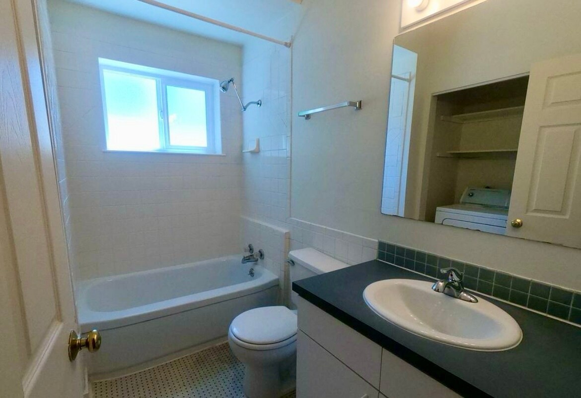 New vanity & plumbing. Includes new large capacity washer/dryer. - 920 University Ave
