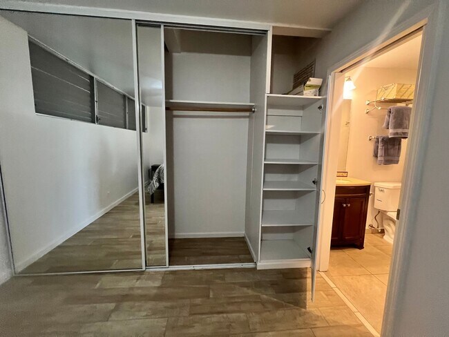 Building Photo - One bedroom semi-furnished bottom floor condo