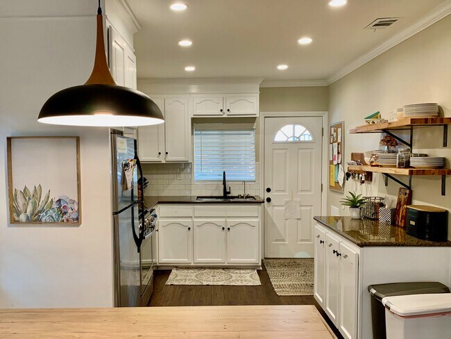Kitchen facing driveway entry door - 900 N El Molino Ave.