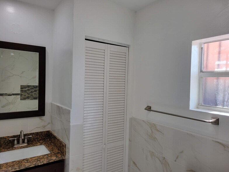 Bathroom vanity and linen closet - 1646 NE 150th ST