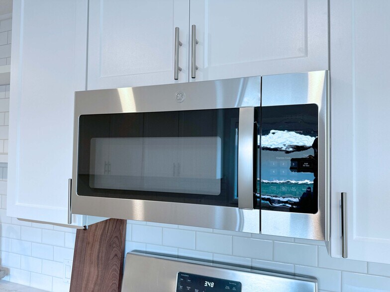 Convenient built-in microwave for quick and easy meal prep. - 4570 58th St
