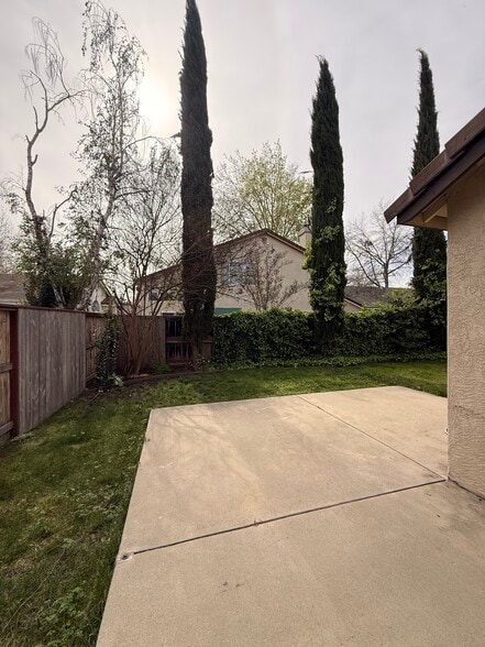 Backyard just outside sliding patio door (on the right.) - 3326 Amberfield Cir