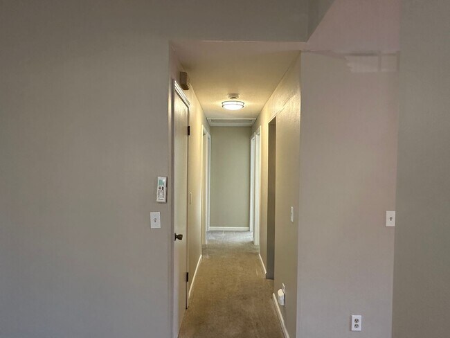 Building Photo - Spacious & Stylish 3BD Home with Iconic Stone Fireplace + Soaking Tub