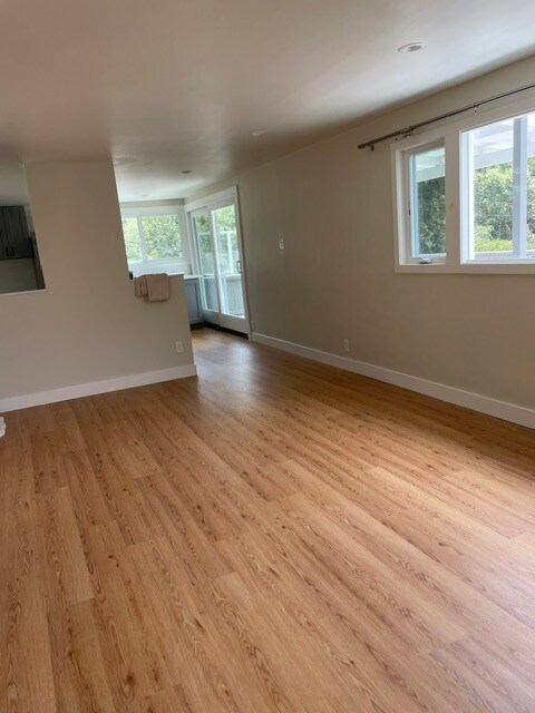 Living room looking toward the kitchen and sliding door to the extra large deck. - 101 Granlee Rd