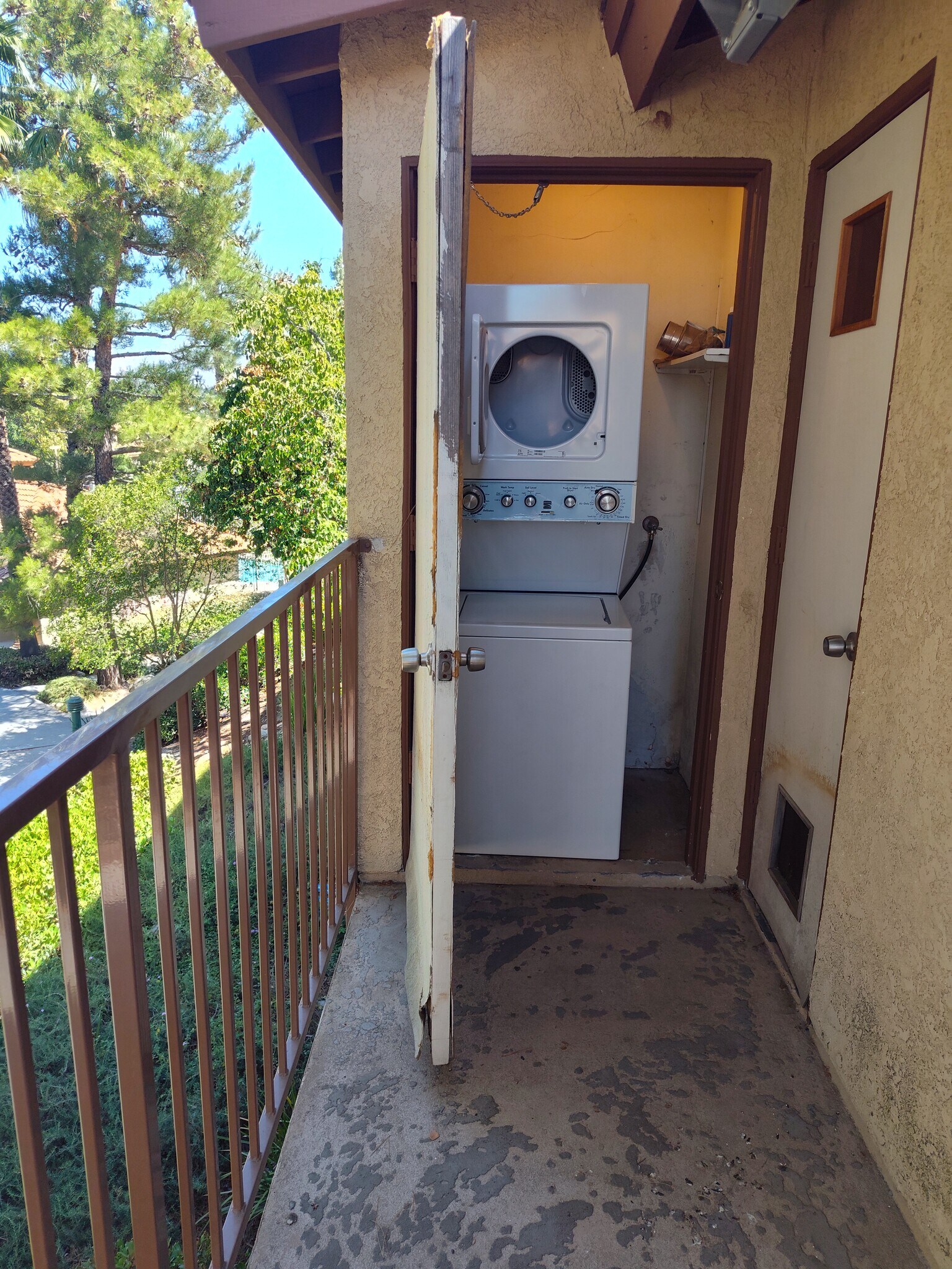 Washer dryer unit on balcony, balcony has been refinished - 1365 Crafton Ave