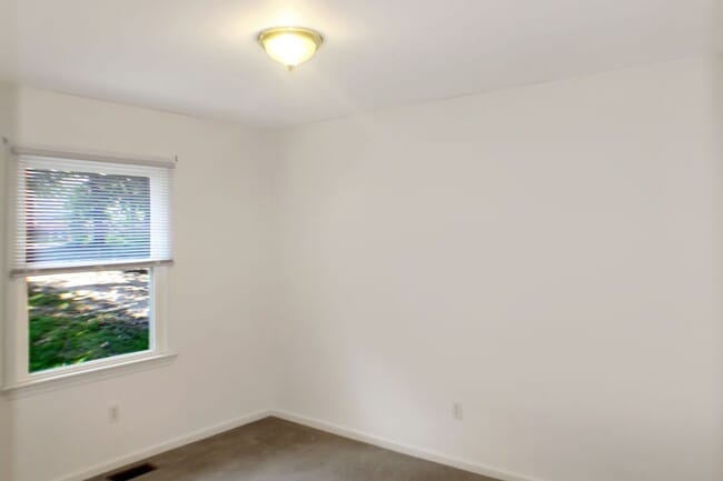 Building Photo - Single level living, backs to trees