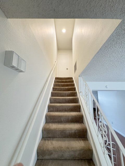 staircase to bedrooms - 118E Oliva Ct
