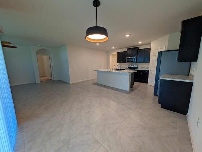 Building Photo - Modern 4-Bedroom Home with Large Backyard in Quiet SW Palm Bay – Available Mid-June
