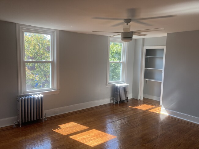 The front bedroom on the 2nd floor also enjoys excellent light and airflow thanks to three windows a - 2621 E Somerset St