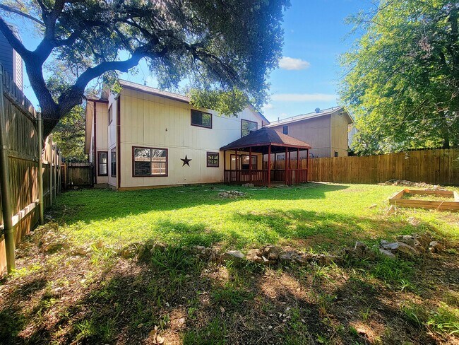 Building Photo - Warm & Inviting 4BR / 2.5BA Home with Covered Deck and 2-Car Garage