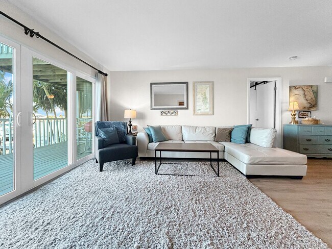 Building Photo - AVAILABLE APRIL 1ST! Stunning Waterfront Luxury – Fully Renovated & Furnished 2 Bed / 2 Bath