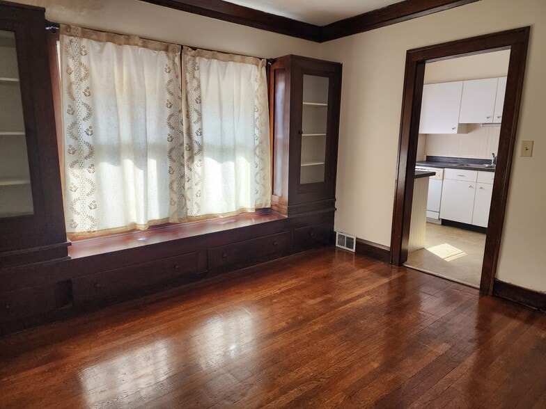Spacious Dining Room with Hardwood floor and built-in cabinets. Curtains included - 1382 Webb Rd
