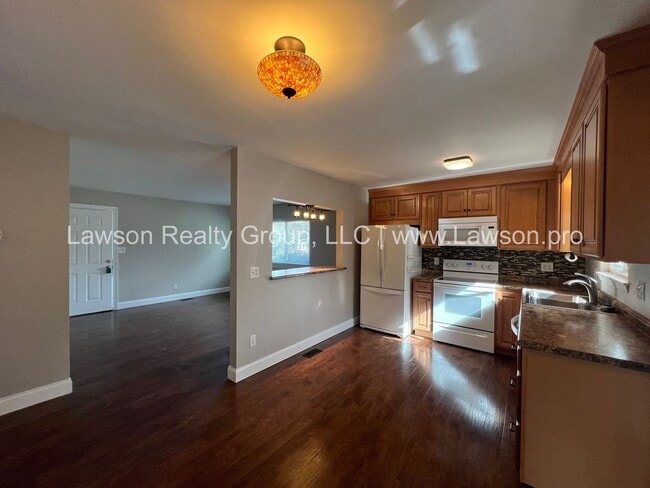 Building Photo - One Level Living- Beautifully Landscaped Yard and Attached Carport