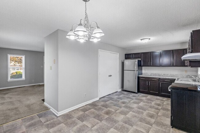 Building Photo - NE Home - Updated Kitchen and Bathrooms!  SS Appliances, Fire Place, Front Porch & Deck, Fenced Y...