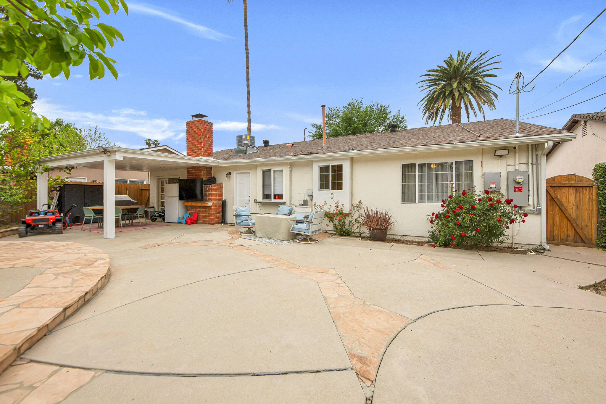 Large covered patio with recessed lights & fridge! - 6908 Royer Ave