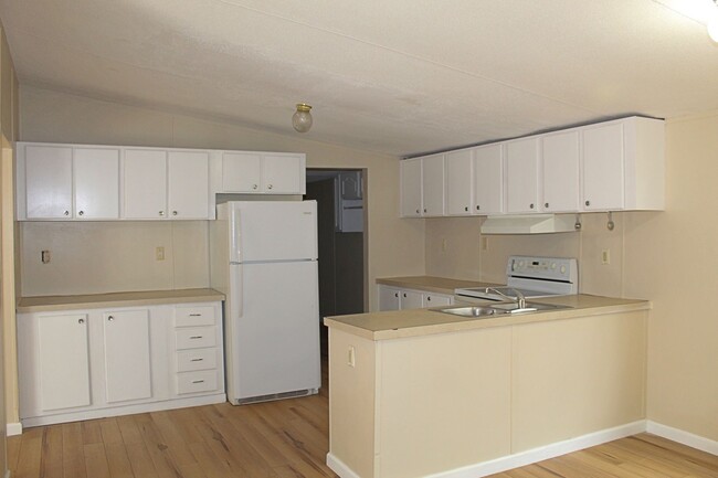 Building Photo - Four bedroom mobile home rental available now